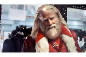 John Travolta Channels Grease Santa Claus in New Holiday Ad