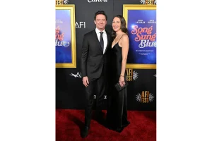 Hugh Jackman Stuns in Red Carpet Appearance With Sutton Foster